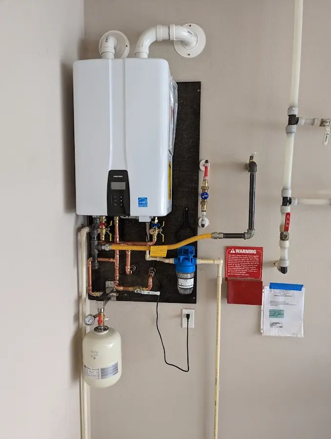 Professional plumber installing copper piping in a Jarrell home